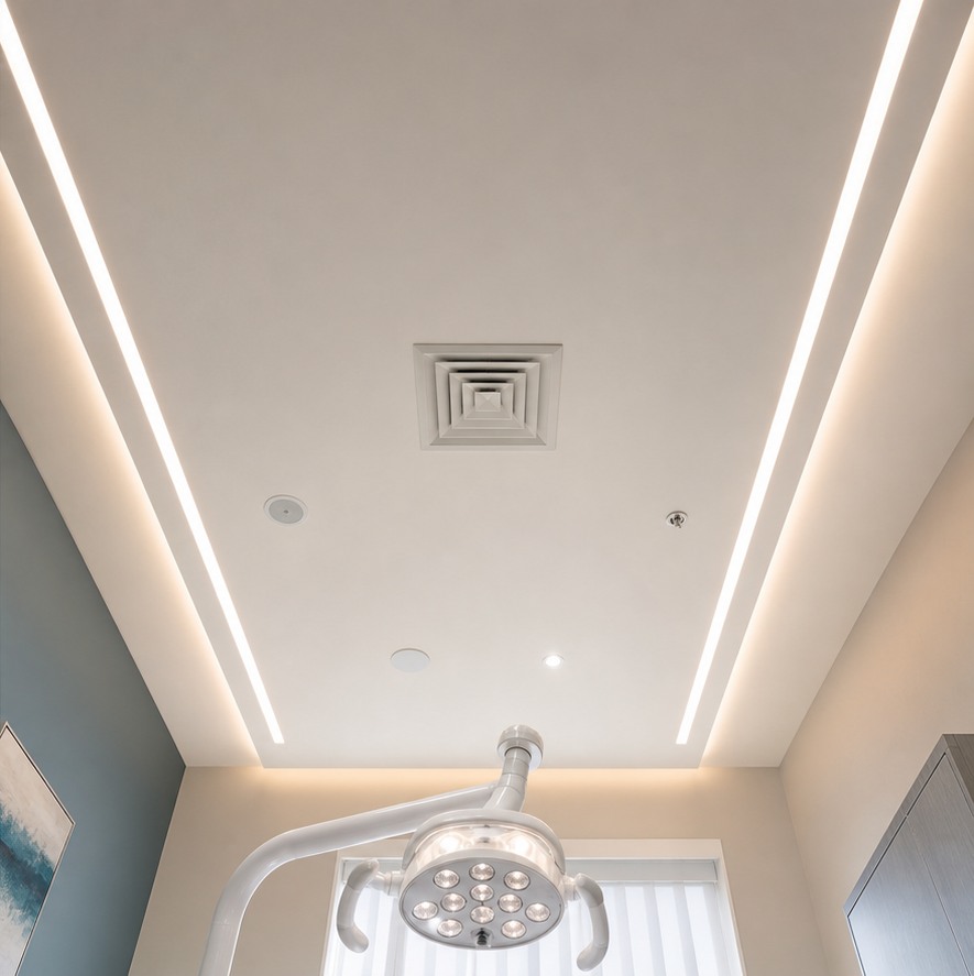 After: dental patient view of a clean stretch ceiling with soft integrated lighting