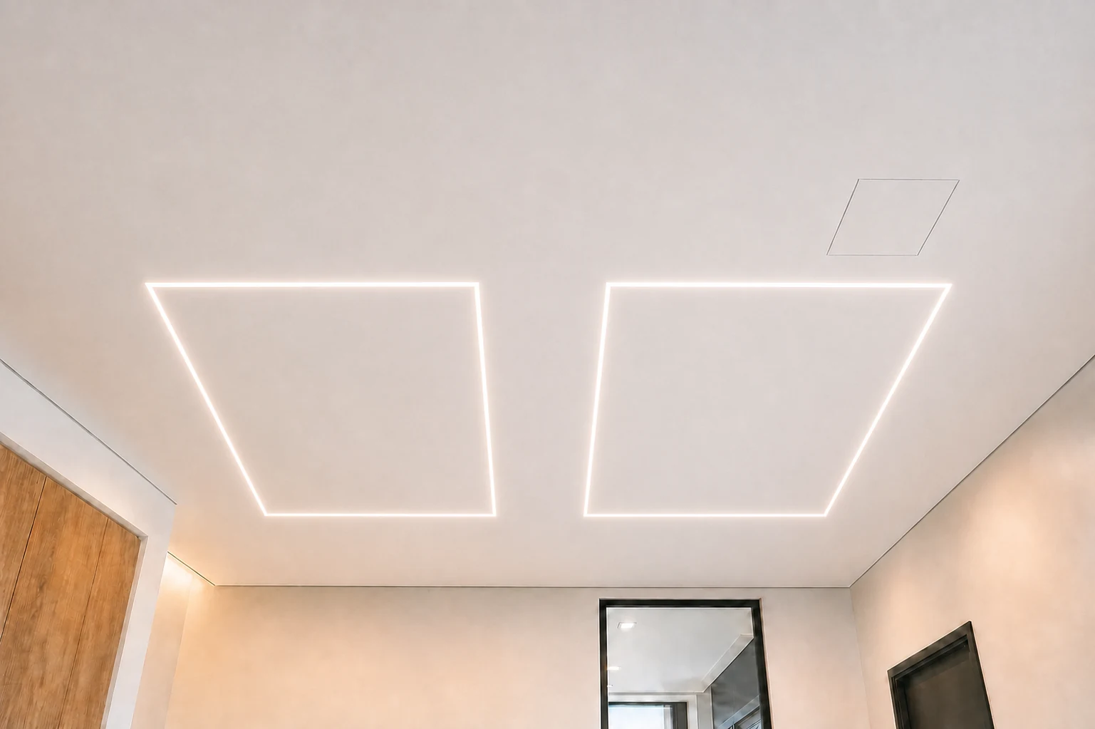 Finished taut ceiling with two large rectangular recessed linear LED outlines, a flush access hatch, and clean perimeter edges